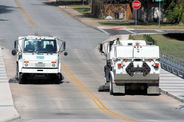 Sweepers passing on a roadway