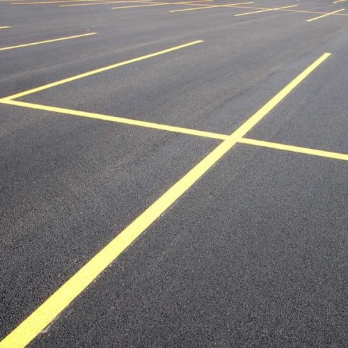 Freshly painted yellow parking lot stripes