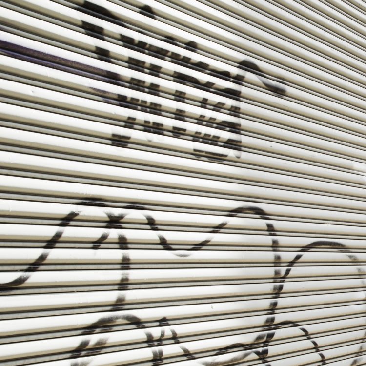 Unsightly graffiti on a roll up door