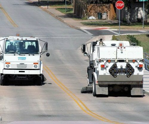 Sweepers passing on a roadway